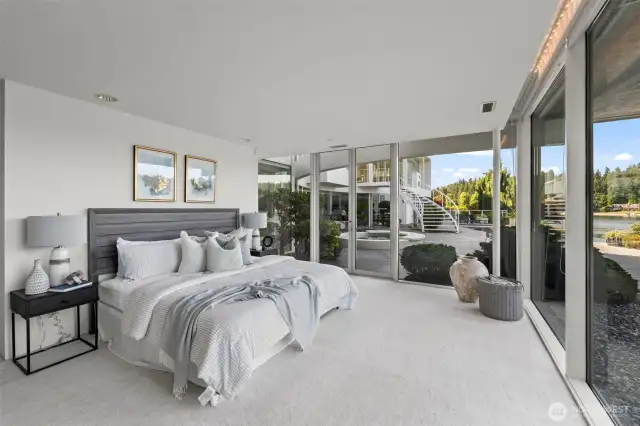 This guest room feels like a palatial suite of light and views.  Each bedroom has it's own french doors to the patio making it easy to step out for a morning coffee by the pool.