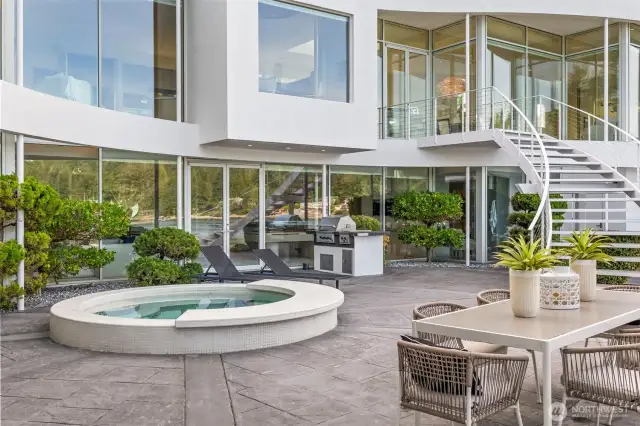 From morning coffee to evening celebrations, this expansive patio is designed for effortless entertaining — steps from the kitchen, the spa, and the water.