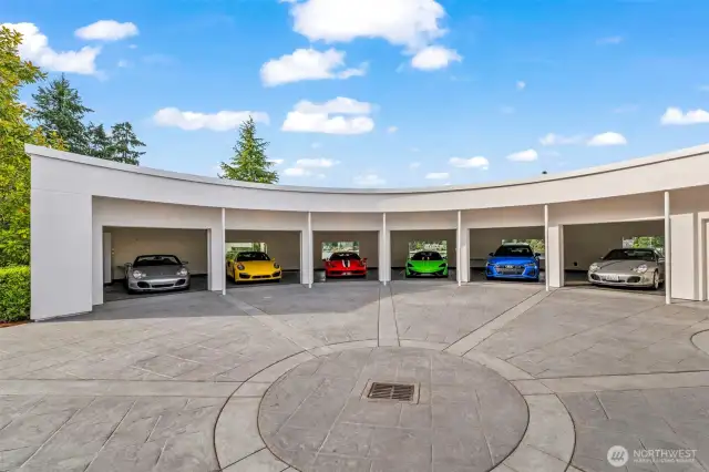 A dramatic, curved six-bay showcase — where modern design meets automotive passion.