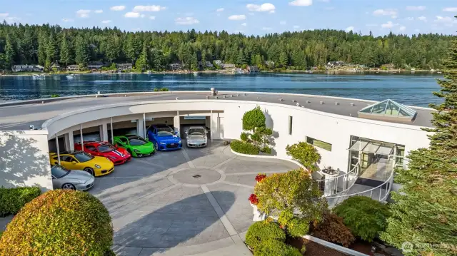 From above, the home’s architectural poetry comes into view — sweeping curves echo the shoreline, creating a perfect harmony between structure and setting.