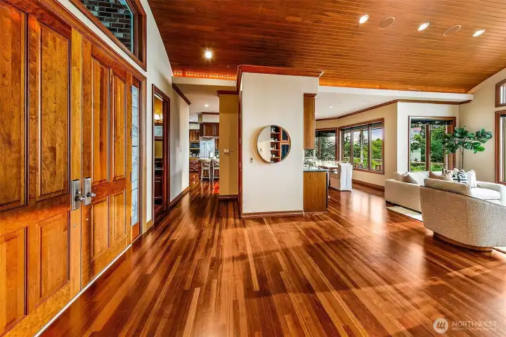 back to to foyer looking on to the elevator bay, wet bar, kitchen & dining