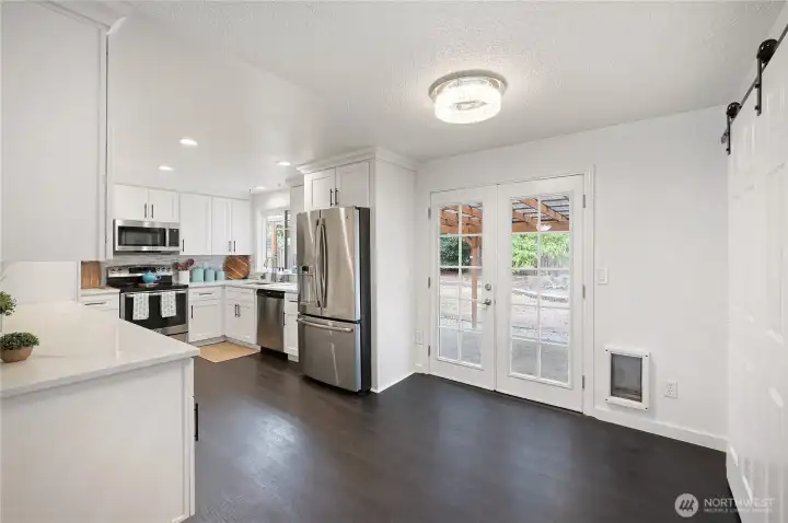 dining with french doors to covered patio