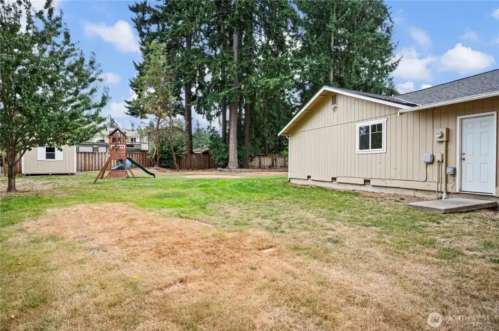 Big shed with loft area, play structure, side garage door, Side yard facing S.