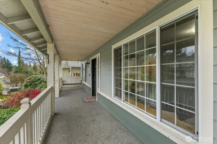What a cute entry with the porch swing!