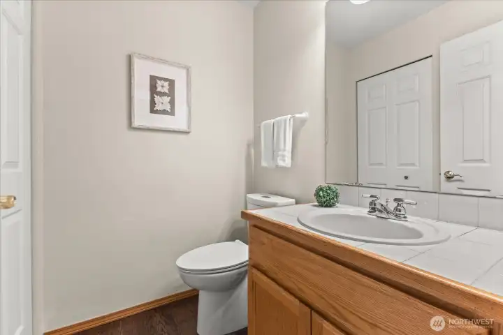 Half bath on the main floor. The closet goes under the stairs (it's deep!! lots of storage)