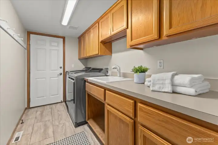 Laundry Room is huge! You have tons of space! Doorway leads to the massive 3 car garage!