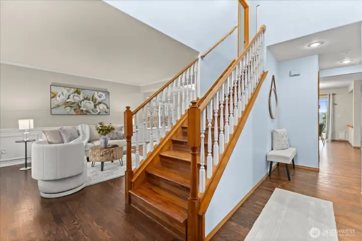 Beautiful entry with hardwood floors and charming staircase!