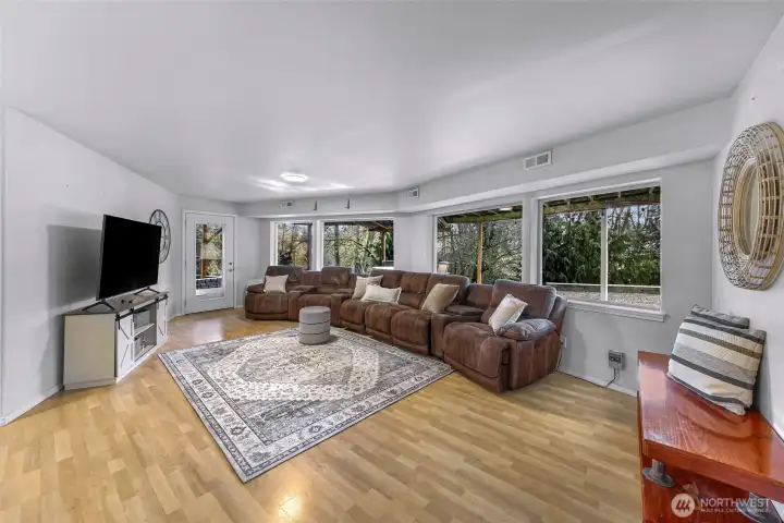 Lower Level is a second living area private exterior entrance, full kitchen, bath and 2 bedrooms.