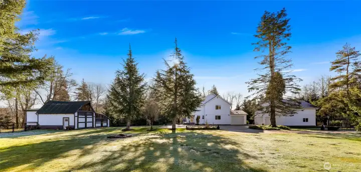 Acreage, outbuildings and mature landscaping