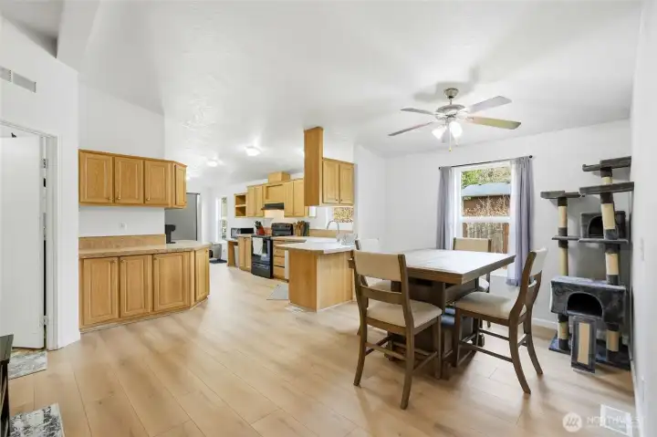 Open-concept dining and living area ideal for everyday living and entertaining.