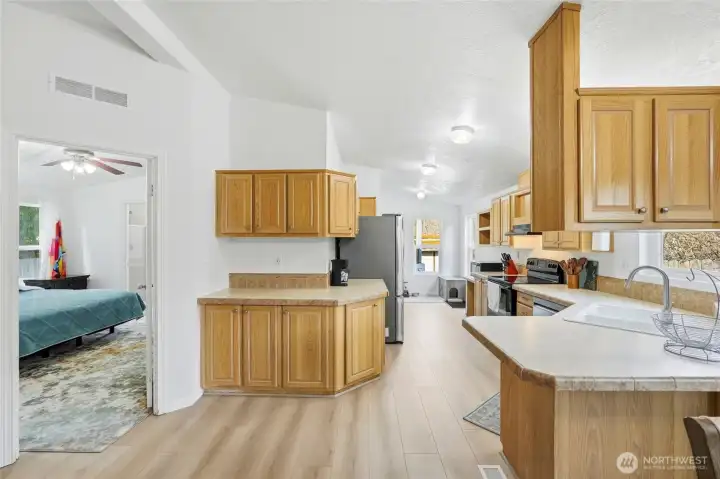 Kitchen view showcasing functional layout and adjacent dining area.
