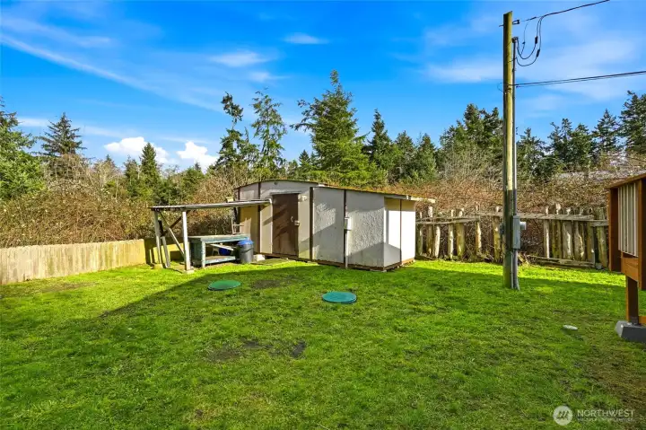 Side yard view with landscaping and outdoor potential.