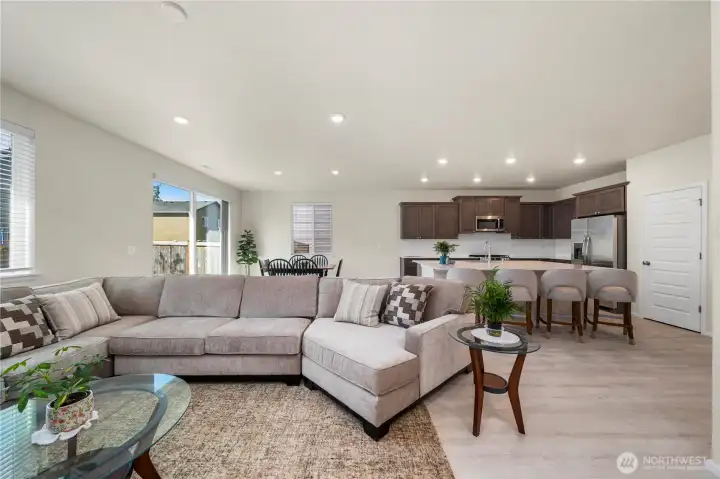 Open layout of the great room with view of the eat-in kitchen