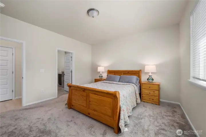 Primary suite, bathroom door to the left
