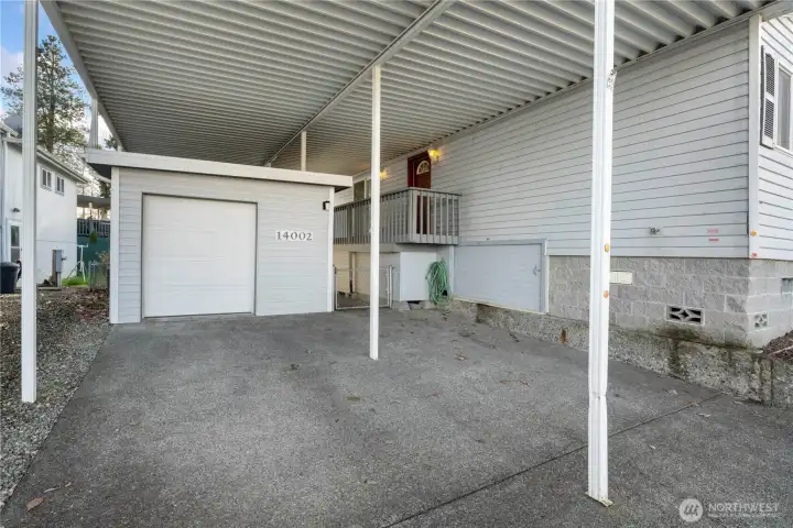 Spacious two-car covered carport with a large storage shed with tons of space, all connected to the home for comfortable access year-round. Spacious two-car covered carport with a large storage shed with tons of space, all connected to the home for comfortable access year-round.