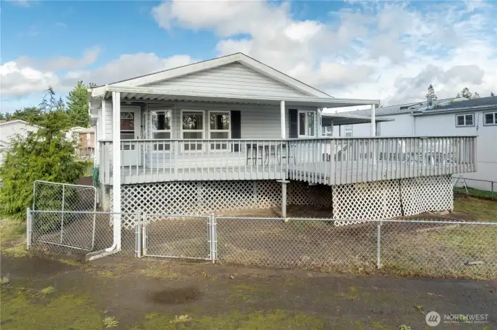 Welcoming front porch—an ideal spot to sit back, relax, and enjoy the peaceful surroundings. Welcoming front porch—an ideal spot to sit back, relax, and enjoy the peaceful surroundings.
