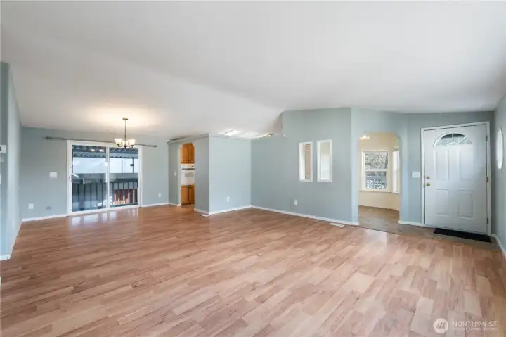 Light-filled living room with a slider leading out to the deck for easy indoor-outdoor living.