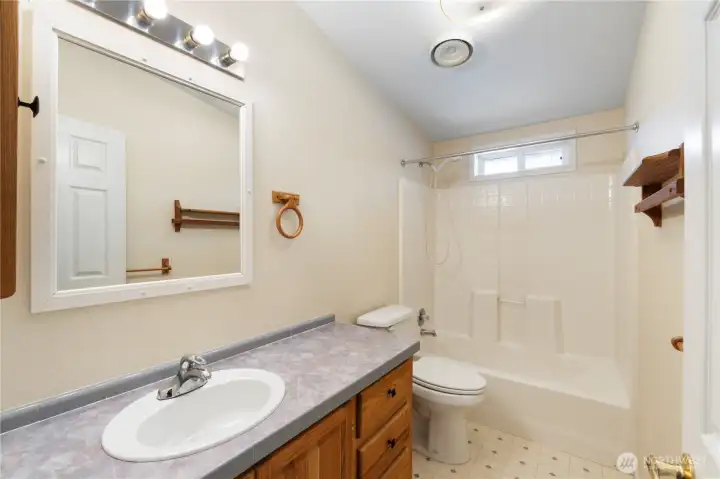 Well-appointed guest bathroom with practical layout and plenty of space.