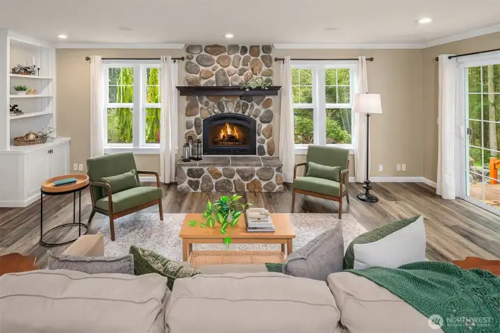 Custom river rock gas fireplace for warmth. with built-ins for old-world charm