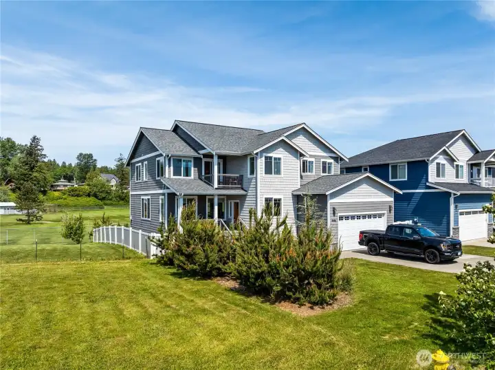 Multi-faceted design adds interest to the exterior look of this home. Front covered deck is a great place to enjoy the water views. Multi-faceted design adds interest to the exterior look of this home. Front covered deck is a great place to enjoy the water views.