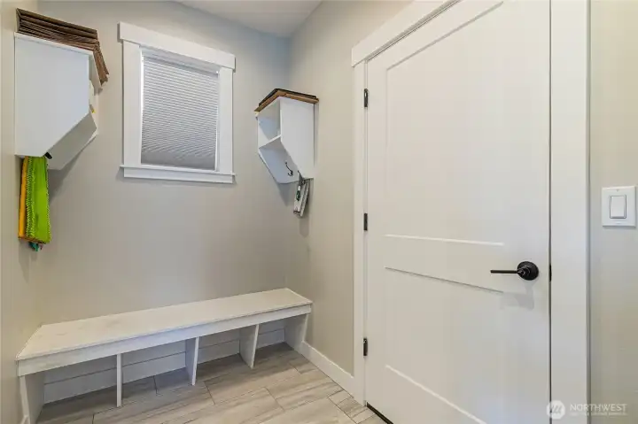 Mud room just off the garage with shoe bench. Mud room just off the garage with shoe bench.