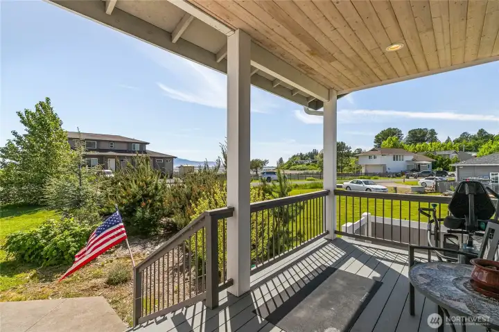 Covered front deck with views across to the bay. Covered front deck with views across to the bay.