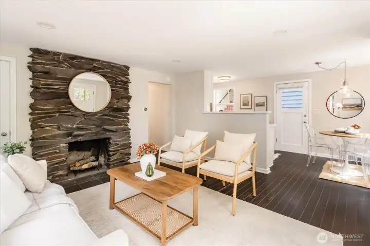 Beautiful basalt fireplace anchors the living spaces.