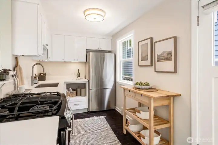 New kitchen counters, sink, garbage disposal.