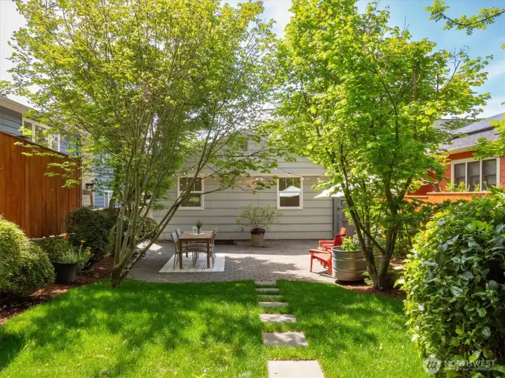 Sunny and private backyard with new sod.