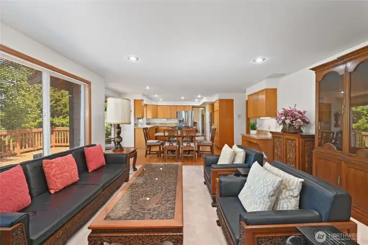 Family room open to the kitchen and informal dining area Family room open to the kitchen and informal dining area