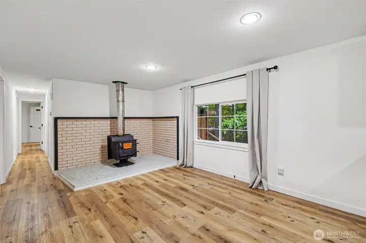 Cozy area featuring a warm wood-burning fireplace