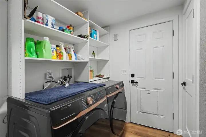 Laundry room with direct access to the private back deck and backyard
