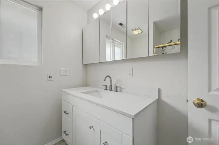 Same full-bath with updated vanity.