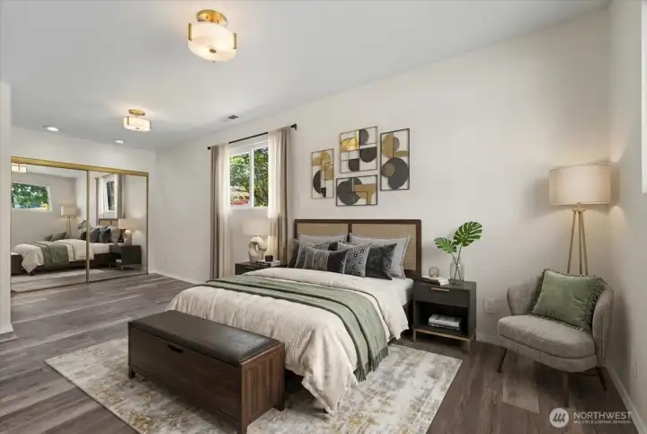 Virtually staged primary bedroom on main-level.
