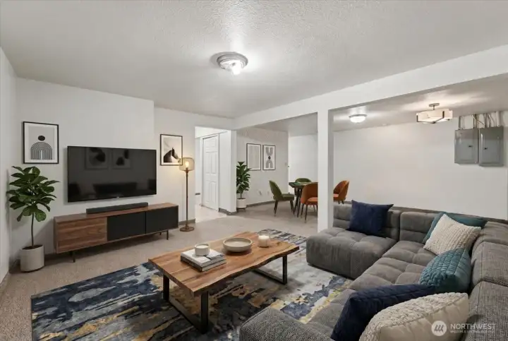 Virtually staged entertainment area in basement.
