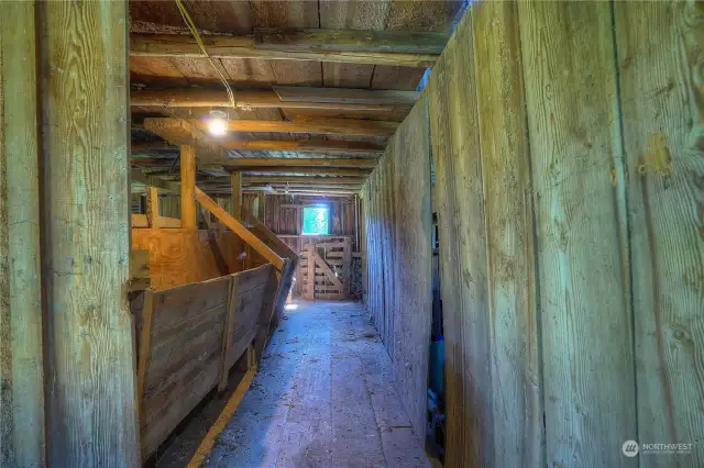 feeding trough inside of the barn.