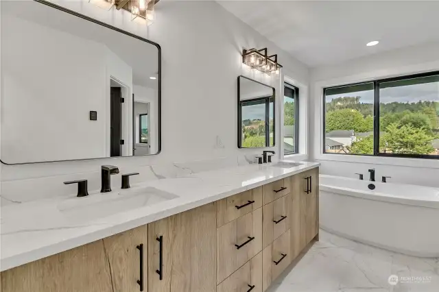 Heated tile floors & a large vanity area with double sinks