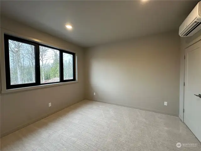 Large guest bedroom #2 upstairs with tons of light and individual heat & A/C unit.