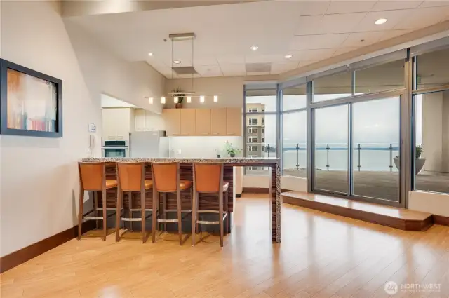 Here's the kitchen with bar in the Club room which leads to the walking track of the new updated rooftop deck of the commercial side of the residential tower.