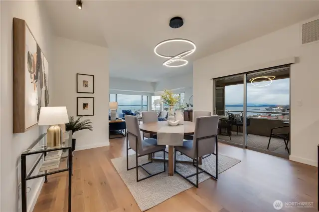 Lovely dining area which leads to spacious private covered deck to watch the sunsets over the Olympic Mtns.