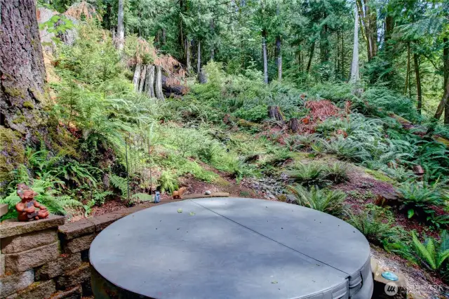Relax in the hot tub surrounded by nature.