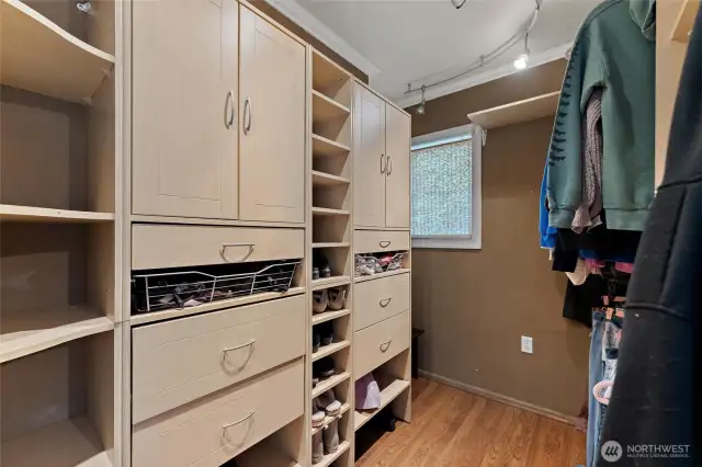 Custom built-in shelving and ample storage space.