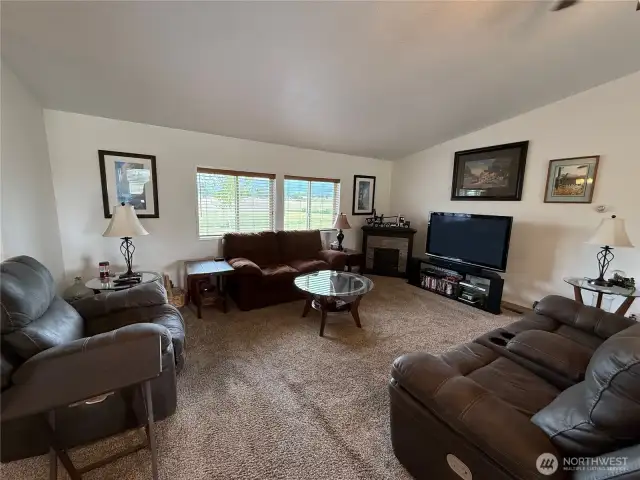 Livingroom with ceiling fan and plenty of natural light