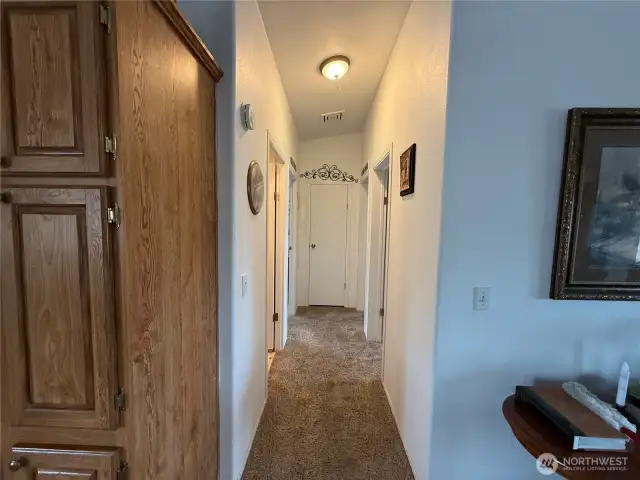Hallway to 2 bedrooms, Main bathroom and laundry room.