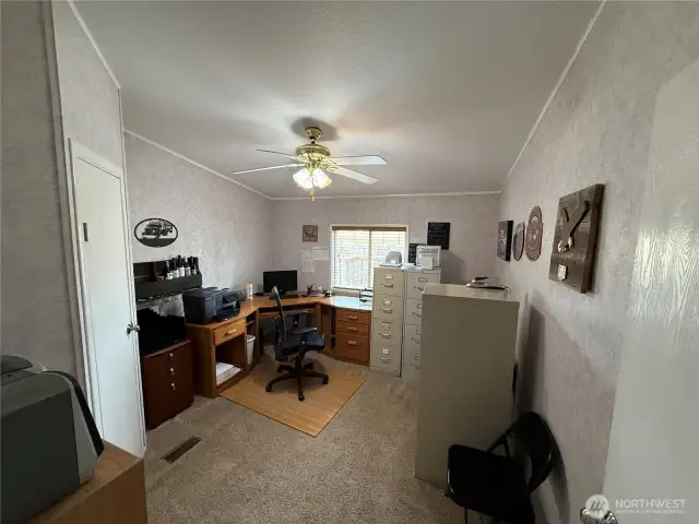 Bedroom 2 is set up as a office with a walk in closet