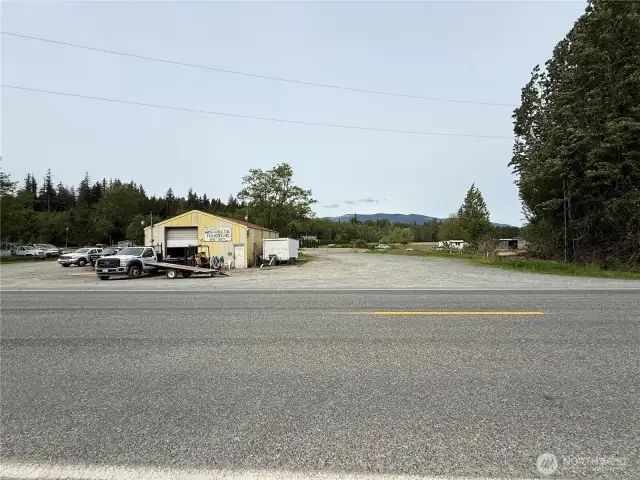 Large shop with plenty of parking and two driveways for easy maneuvering of big rigs.