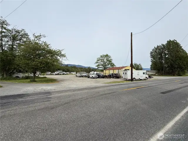 Large shop with plenty of parking and two driveways for easy maneuvering of big rigs.