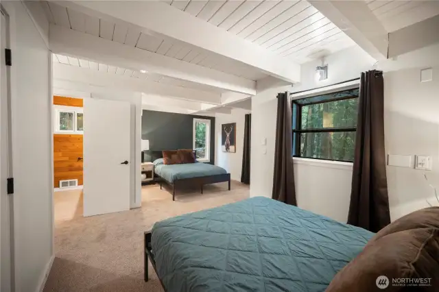 Spacious bedroom with 2 queen beds and en suite bath. additional half bath also on this floor. Each floor has its own laundry room or closet.