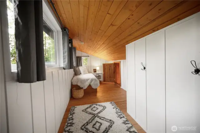 Featuring warm wood ceilings, crisp white walls, and abundant natural light.