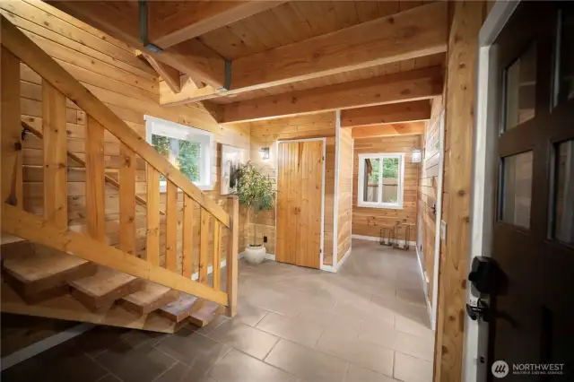 Precision and passion carved into every piece of woodwork. We are back on the first level and ready to check out the 2nd primary bedroom, which is on the main floor, with full main-level living making this home optimal for multi-gen.